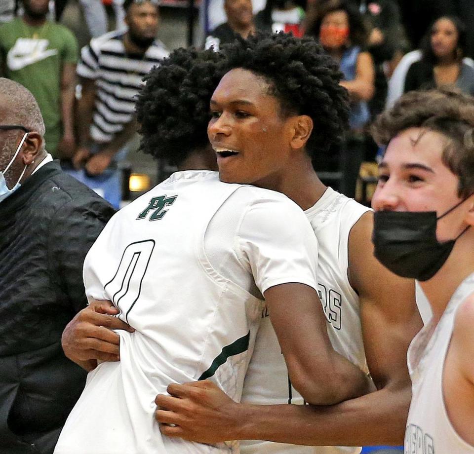 Pinecrest brothers Ausar Thompson (0) and Amen Thompson (1) celebrate after defeating Santa Fe in the FHSAA 4A Boys’ Basketball Finals in Lakeland, Florida, Saturday, March 6, 2021.