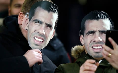 Fans in stands wear a Carlos Tevez mask ahead of the Premier League match at Bramall Lane, Sheffield - Credit: PA