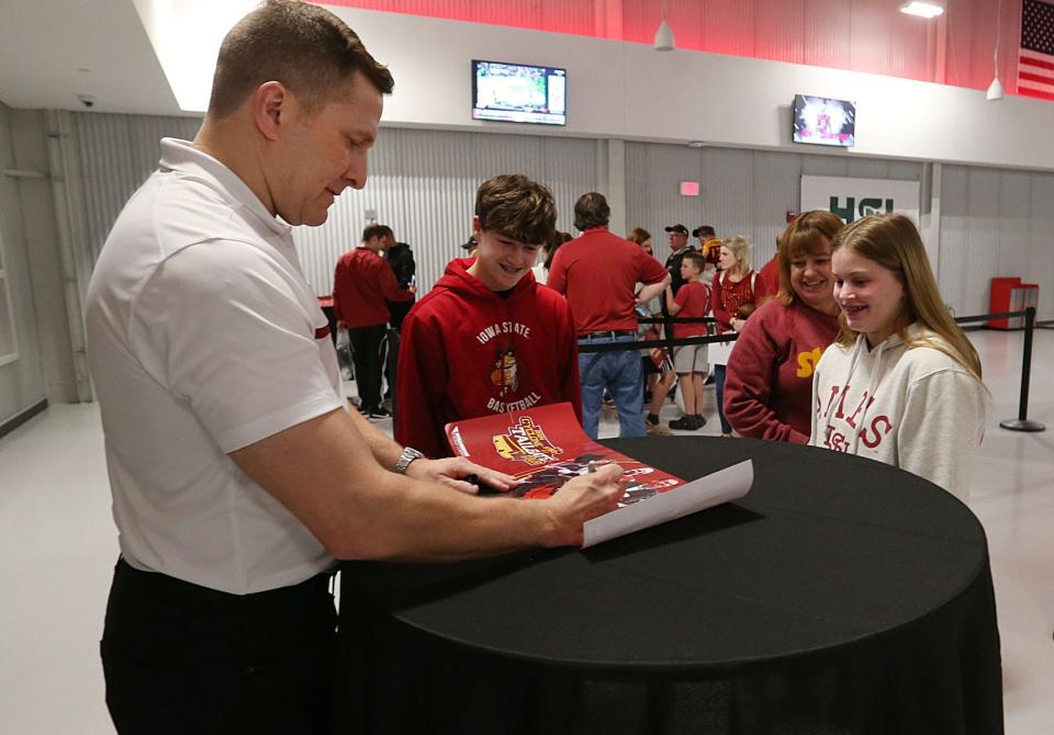 Iowa State men’s basketball coach T.J. Otzelberger signs autographs during the May 9 Cyclones Tailgate Tour at MidAmerican Energy RecPlex in West Des Moines.