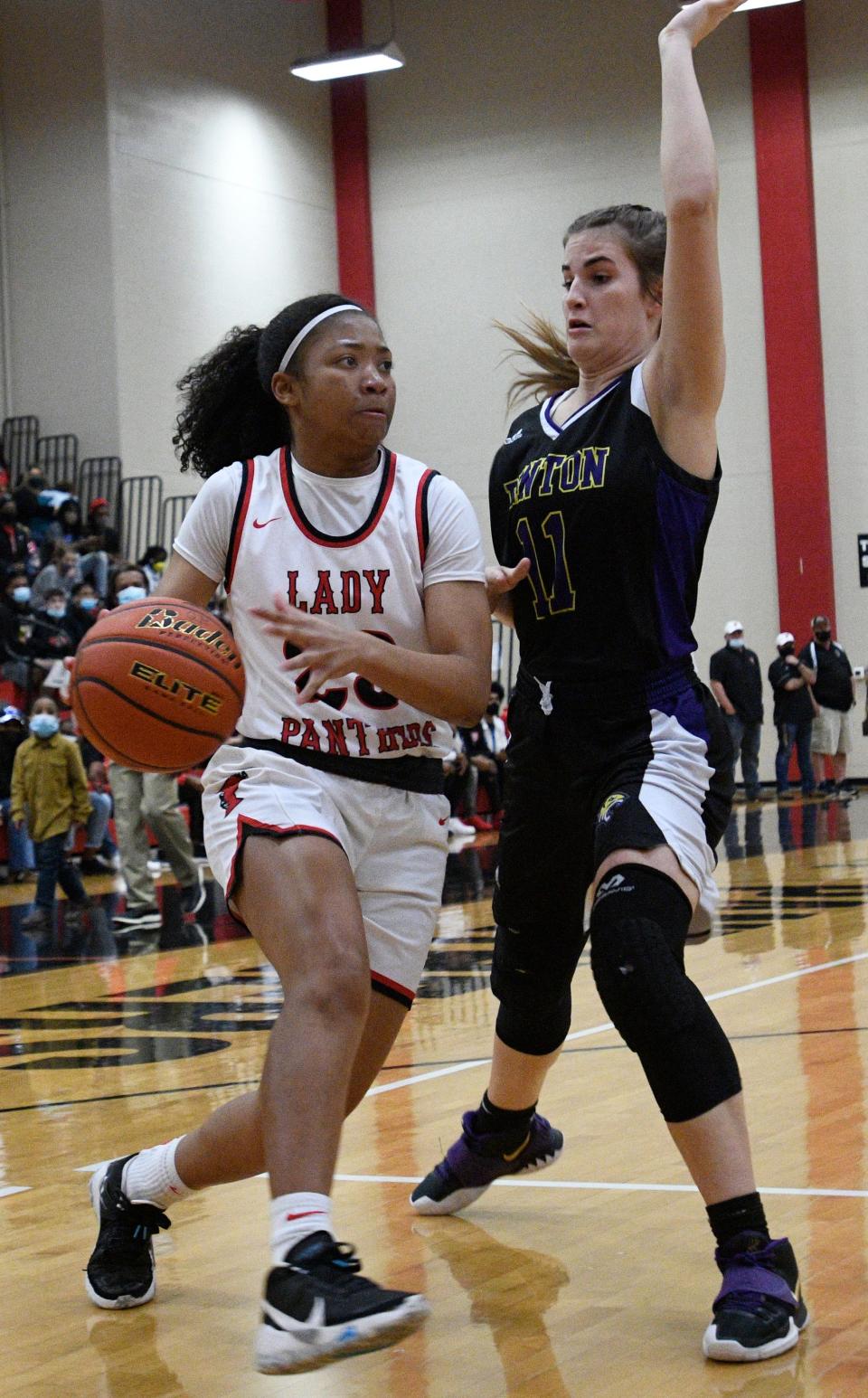 Parkway's Chloe Larry drives past Benton's Marissa Schoth in Thursday's playoff game.