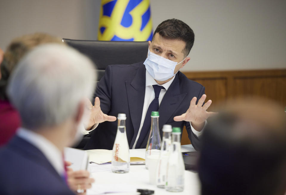 Ukrainian President Volodymyr Zelenskiy, center, talks to U.S. Senators Jeanne Shaheen, D-N.H., Rob Portman, R-Ohio, and Chris Murphy D-Conn., during their meeting in Kyiv, Ukraine, Wednesday, June 2, 2021. (Ukrainian Presidential Press Office via AP)