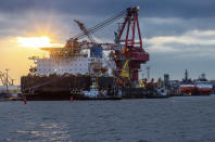 Tugboats get into position on the Russian pipe-laying vessel "Fortuna" in the port of Wismar, Germany, Thursday, Jan 14, 2021. The special vessel is being used for construction work on the German-Russian Nord Stream 2 gas pipeline in the Baltic Sea. ( Jens Buettner/dpa via AP)