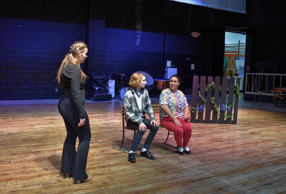 Anna Hittepole, left, and Chance Sayre, middle, discuss a scene with “Anastasia” choreographer Angela Andujar.