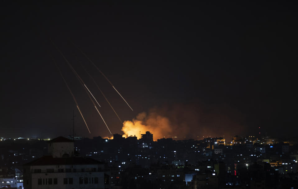 Smoke rises following Israeli missile strikes on Gaza City, Thursday, May 13, 2021. The four-day burst of violence has pushed Israel into uncharted territory — dealing with the most intense fighting it has ever had with Hamas while simultaneously coping with the worst Jewish-Arab violence inside Israel in decades. (AP Photo/Khalil Hamra)