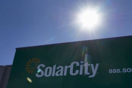 The company's logo is seen on the SolarCity building in Denver in this February 17, 2015 file photo. REUTERS/Rick Wilking/Files