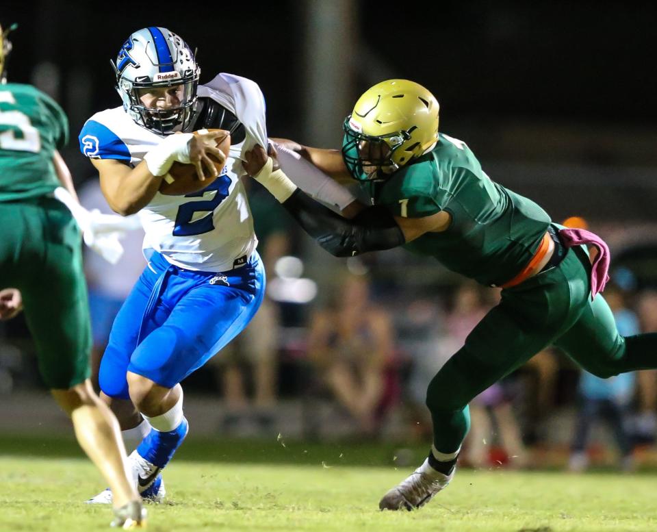 Fleming Island linebacker Ryan Smenda (1), now at Wake Forest, tackles Bartram Trail quarterback Joey Gatewood (2), now at UCF, in the teams' 2017 game. The Golden Eagles and Bears face off for the first time in four years on Friday night, a key District 3-4S clash.