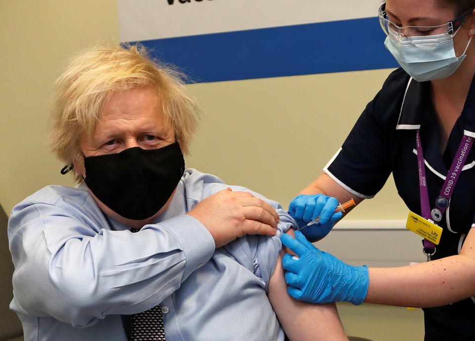 British Prime Minister Boris Johnson receives a dose of the Oxford/AstraZeneca COVID-19 vaccine, amid the coronavirus disease pandemic, in London, Britain March 19, 2021. Frank Augstein/Pool via REUTERS