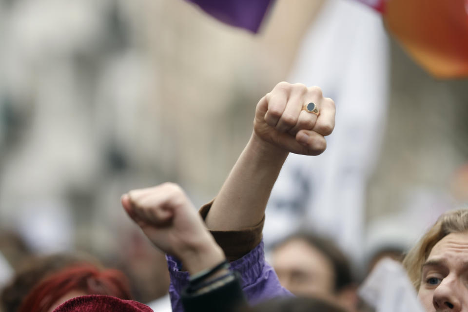 Demonstrators raise their fists as they take part to a protest march against plans to push back France's retirement age, in Strasbourg, eastern France, Tuesday, Jan. 31, 2023. Labor unions aimed to mobilize more than 1 million demonstrators in what one veteran left-wing leader described as a "citizens' insurrection." The nationwide strikes and protests were a crucial test both for President Emmanuel Macron's government and its opponents. (AP Photo/Jean Francois Badias)