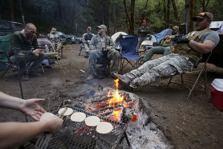 A meal is prepared in a camp as members of the Oath Keepers provide security at the Sugar Pine Mine outside Grants Pass, Oregon April 22, 2015. REUTERS/Jim Urquhart