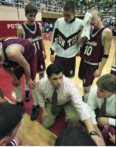 Then-coach Shawn Thornton, center, speaks to his Stroudsburg (Pennsylvania) High School basketball team during a timeout during their game against Lower Merion and Kobe Bryant in the 1996 state quarterfinal round.