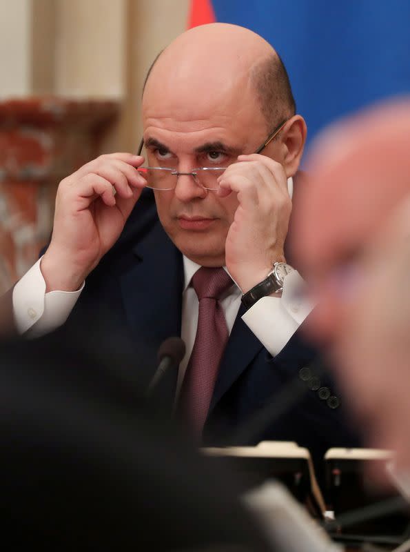 FILE PHOTO: Russian Prime Minister Mikhail Mishustin chairs a meeting with members of the government in Moscow