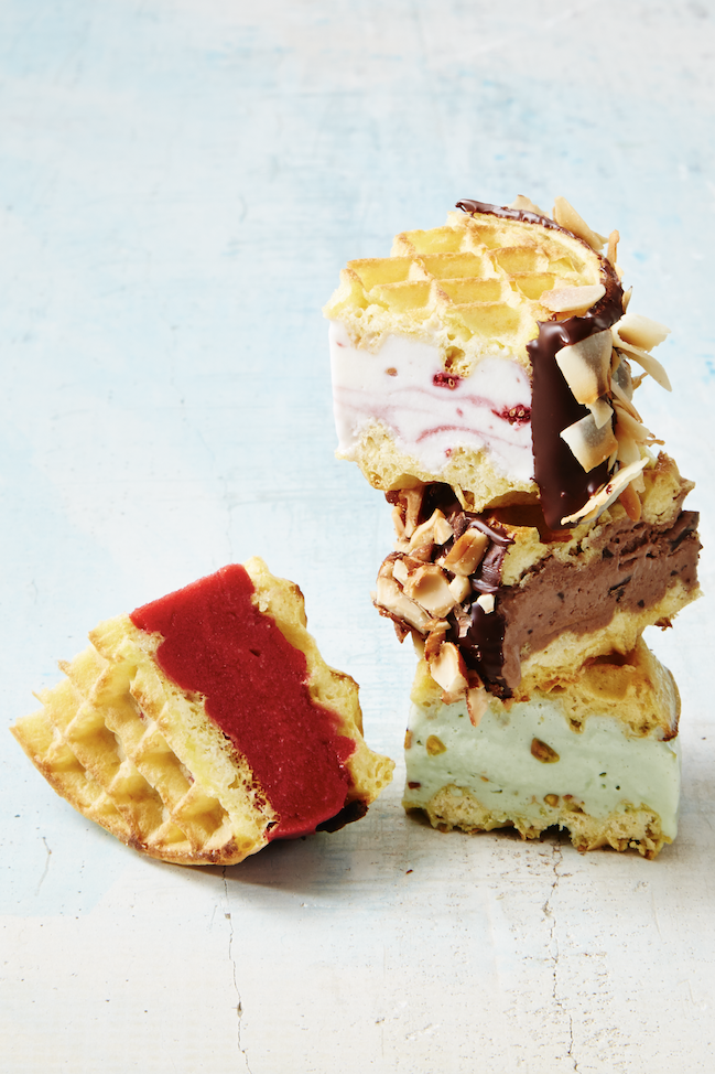 <p>Toast a pack of waffles and use them to sandwich ice creams, gelatos and sorbets. Roll each sandwich in melted chocolate, coconut, nuts or chocolate chips. </p>