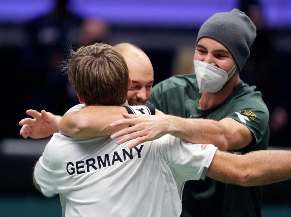 Germany’s Kevin Krawietz, Tim Puetz and Jan-Lennard Struff celebrate beating Great Britain (Michael Probst/AP) (AP)