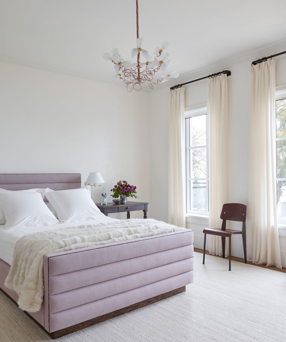 The Quicksilvers’ daughter’s room features a bed clad in linen from Leo’s Upholstery and topped in custom bedding by Muse (look closely and you’ll also see welting by Liberty of London), as well as wool drapery sourced from Coraggio and a braided jute rug by Stark. An antique writing desk, a Jean Prouvé chair, and a chandelier by Ingo Maurer complete the scene.