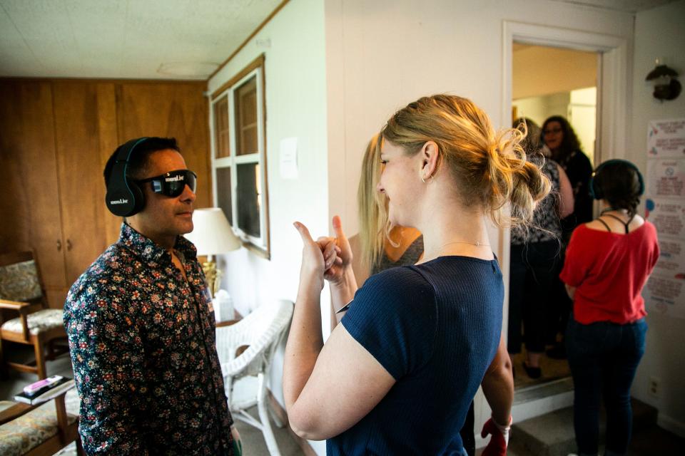 Jorge Marquez is fitted with a pair of DementiaLive glasses at the University of Northern Iowa Dementia Simulation House, Tuesday, May 10, 2022, in Cedar Falls, Iowa.