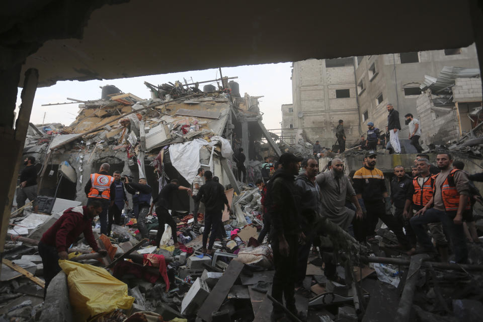 Palestinians look for survivors of the Israeli bombardment of the Gaza Strip in Rafah on Tuesday, Dec. 12, 2023. (AP Photo/Hatem Ali)