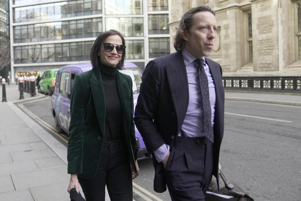 Actress Eva Green arrives at the High Court in London, Monday, Jan. 30, 2023. A lawyer for Eva Green on Thursday, Jan. 26, 2023 accused producers of a collapsed film of trying to damage the performer's reputation by depicting her as a "diva." The French actress, who played Vesper Lynd in James Bond thriller "Casino Royale," is suing producers for a $1 million fee she says she is owed for "A Patriot." (AP Photo/Kin Cheung)