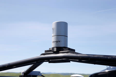 A Velodyne LiDAR sensor is seen mounted on a self-driving vehicle during a self-racing cars event at Thunderhill Raceway in Willows, California, U.S., April 1, 2017. REUTERS/Stephen Lam