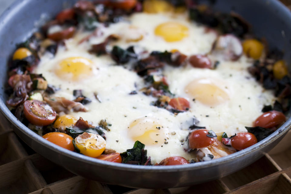 In this image taken on April 15, 20133, skillet garden eggs with fontina are shown in Concord, N.H. (AP Photo/Matthew Mead)