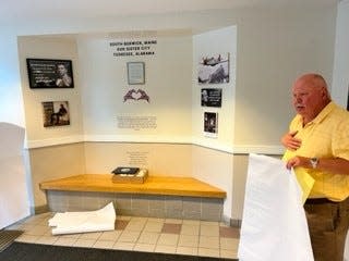 South Berwick Town Manager Tim Pellerin unveils a new exhibit at Town Hall dedicated to the Common Ground Tuskegee South Berwick Sister City relationship and providing an introduction to Tuskegee.