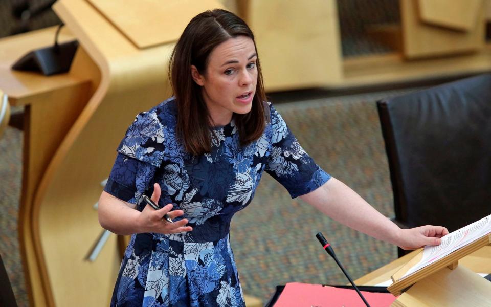 Kate Forbes, the SNP Finance Secretary, making her announcement at Holyrood on Thursday - Fraser Bremner/PA