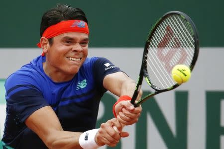 Tennis - French Open - Roland Garros - Milos Raonic of Canada vs Andrej Martin of Slovakia. - Paris, France - 27/05/16. Milos Raonic returns the ball. REUTERS/Pascal Rossignol