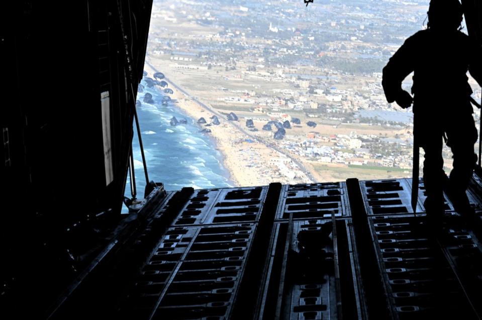 PHOTO: A U.S. Air Force loadmaster releases humanitarian aid pallets of food over Gaza, Mar. 2, 2024.  (Staff Sgt. Jasmonet Holmes/USAF)