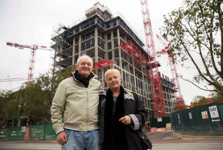 Larry and Janet Colfer pose for a portrait near the site of their former Heygate estate home by the Elephant Park development in south London, Britain October 15, 2015. REUTERS/Neil Hall