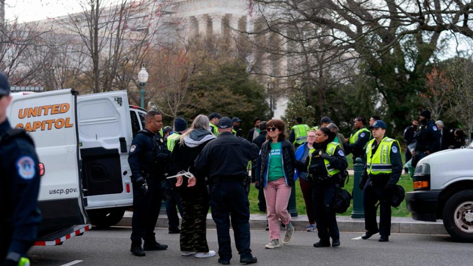 PHOTO: Abortion-rights activists are arrested by U.S. Capitol police as their protest outside of the Supreme Court during a rally March 26, 2024, in Washington. (Jose Luis Magana/AP)