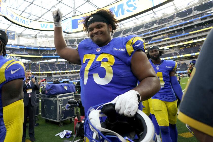 Los Angeles Rams guard Steve Avila (73) celebrates following a win over the Arizona Cardinals after an NFL football game Sunday, Oct. 15, 2023, in Inglewood, Calif. (AP Photo/Ashley Landis)