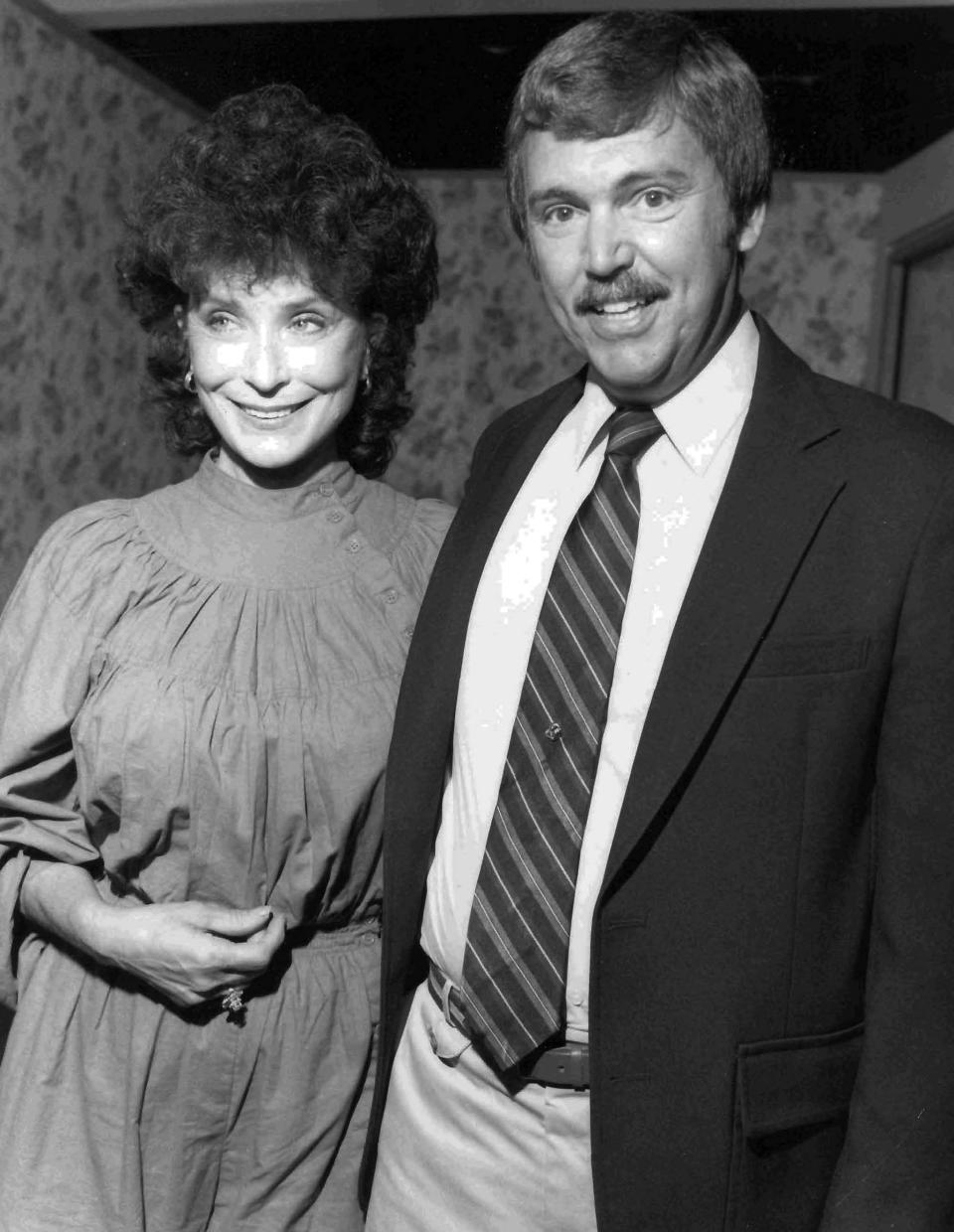 In this undated photo, journalist Joe Edwards poses with entertainer Loretta Lynn. Edwards, who chronicled Tennessee news for more than 40 years as a newsman for The Associated Press and helped “Rocky Top” become a state song, died Friday, Feb. 3, 2023. He was 75. (AP Photo/Mark Humphrey)