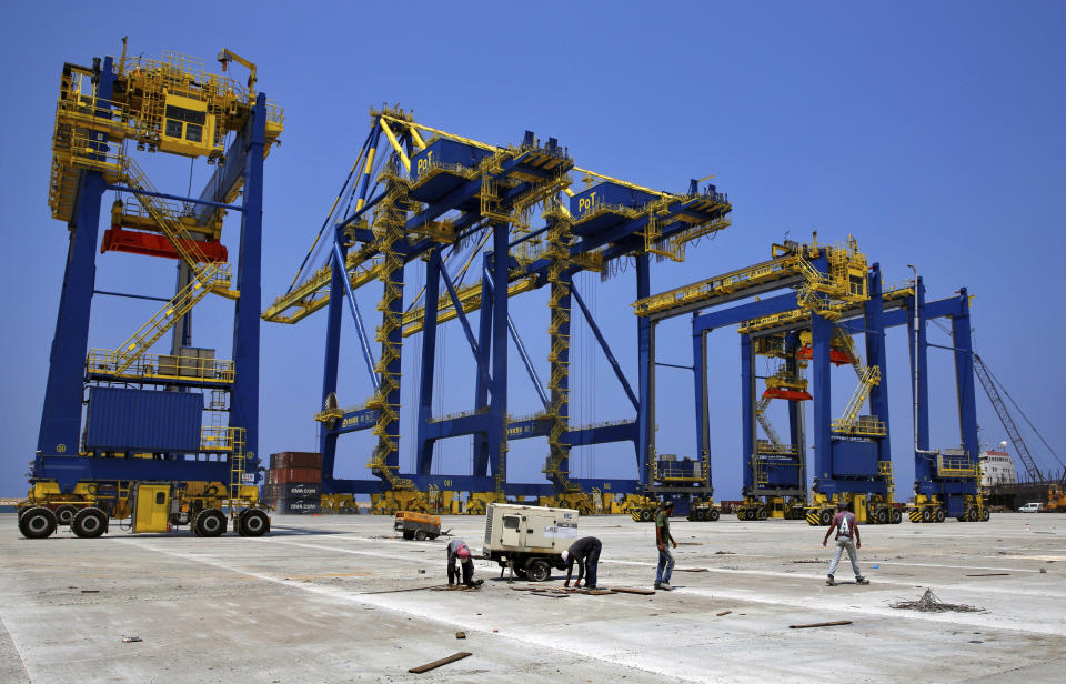 FILE - Construction workers in the port of the northern city of Tripoli, Lebanon, Aug. 9, 2017. A Syrian ship carrying what Ukraine says is grain stolen by Russia remained docked at a port in Lebanon on Friday, July 29, 2022, as Lebanese customs officials inspected the vessel and its cargo, officials said. The ship is carrying 5,000 tons of flour and 5,000 tons of barley illegally taken from Ukraine, the war-torn country's embassy in Beirut said. (AP Photo/Bilal Hussein, File)