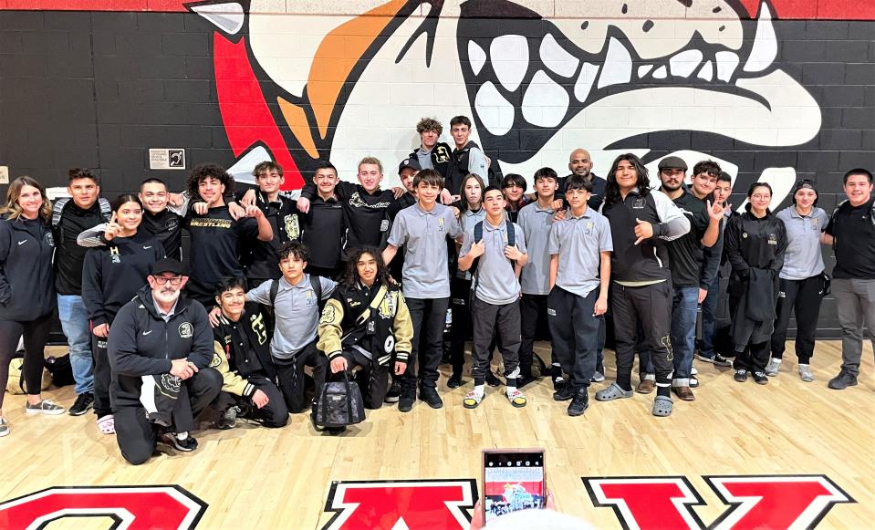 The Hesperia boys wrestling team poses for a photo after capturing the team title at the Mojave River League Finals on Friday, Feb. 3, 2023.