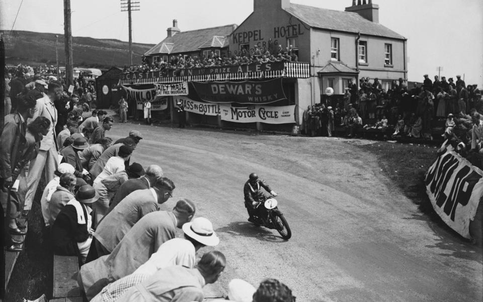 Stanley Woods at Creg-ny-Baa on his Velocette during the Senior TT (Tourist Trophy) race on the Isle of Man, 19th June 1936. - Fox Photos/Hulton Archive/Getty Images