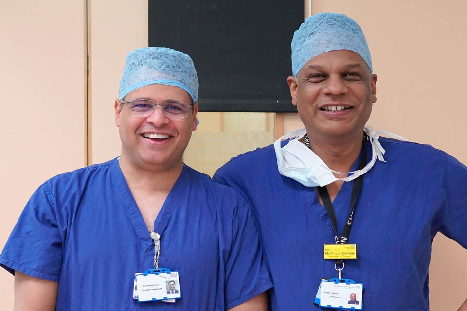 In this photo taken in early 2020 Dr. Amged El-Hawrani poses for a photo with his friend and colleague Dr Ahmed Haroun. During a pandemic, heroes wear scrubs. Amged El-Hawrani was one of them, a doctor who went to work every day as the coronavirus pandemic took hold even though he might be exposed, risking his own life. The 55-year-old died on March 28, becoming one of the first doctors in Britain’s National Health Service to succumb to COVID-19 and a symbol of the acute danger all health workers brave. (Amged El-Hawrani via AP)