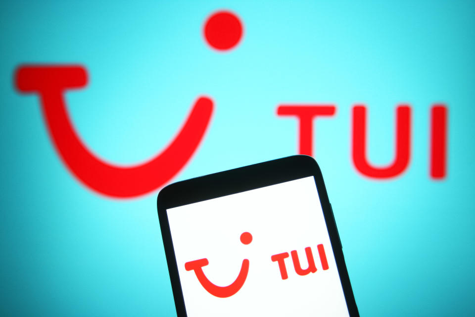 UKRAINE - 2021/08/13: In this photo illustration a TUI Group (Touristik Union International) logo of a travel and tourism company is seen on a smartphone and a pc screen. (Photo Illustration by Pavlo Gonchar/SOPA Images/LightRocket via Getty Images)