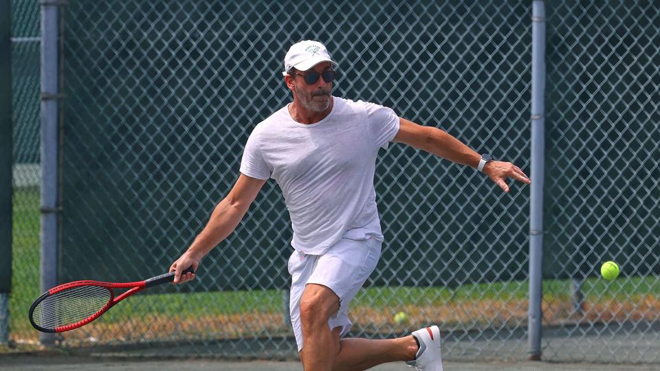 <p>Jon Hamm shows off his athletic prowess in The Hamptons, New York, on July 29.</p>