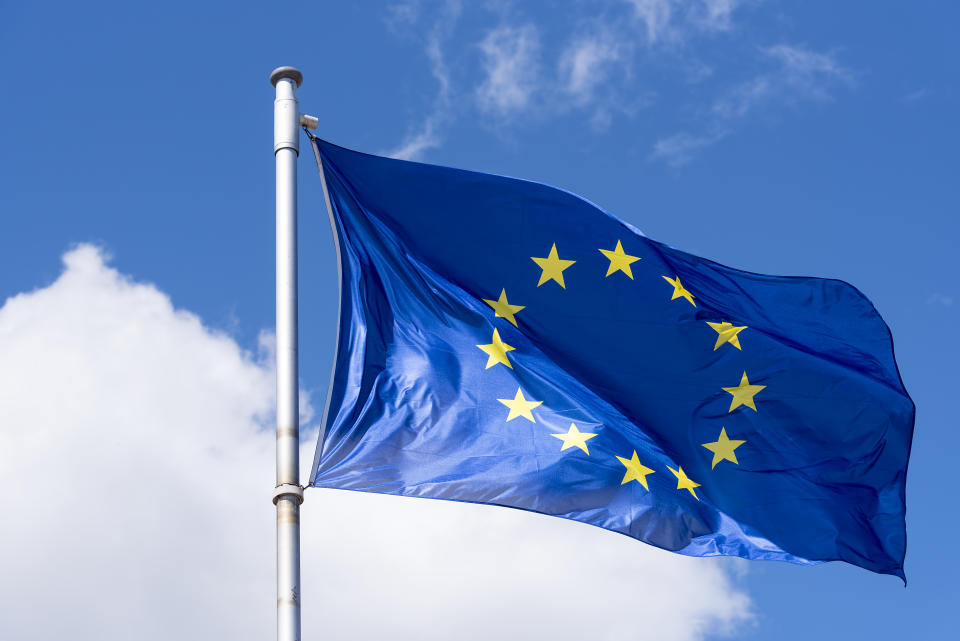 EU Flag waving against blue Sky