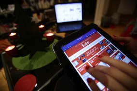 File photo dated 25/12/2013 of a woman viewing a sale being promoted on the Currys website on a tablet, in London. More Britons than ever did their Christmas shopping online in December as almost one in five non-food purchases were made on the internet. PRESS ASSOCIATION Photo. Issue date: Friday January 10, 2014. Web sales growth accelerated to 19.2% compared with the same month in 2012, the fastest rate for more than three years - while overall UK retail sales grew by just 0.4% on a like-for-like basis. See PA story ECONOMY Retail. Photo credit should read: Yui Mok/PA Wire