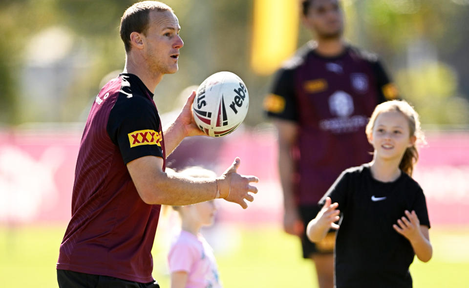 Daly Cherry-Evans, pictured here with his daughters during a Queensland Maroons training session.