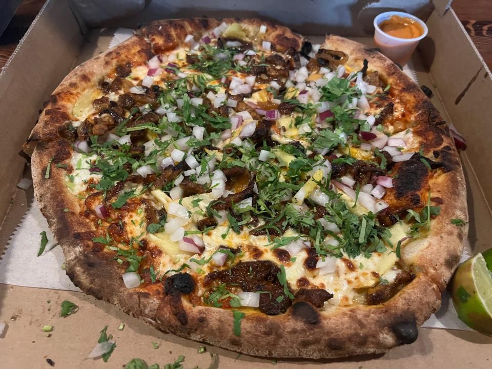 Al pastor pizza at Victor's Pizza Truck, which sells wood-fired Mexican pizza at breweries in Philadelphia and Bucks County. The truck posts its future locations at instagram.com/victorspizzatruck.