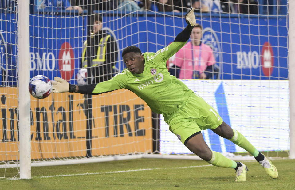 Toronto FC goalkeeper Sean Johnson attempts a save against CF Montreal during first-half MLS soccer match action in Montreal, Saturday, May 13, 2023. (Graham Hughes/The Canadian Press via AP)