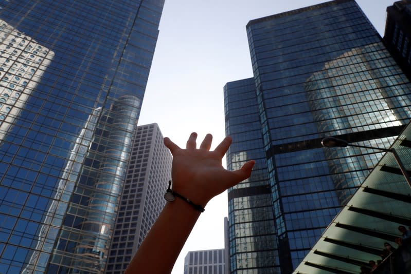 A protester holds up their hand during a demonstration in Central, Hong Kong