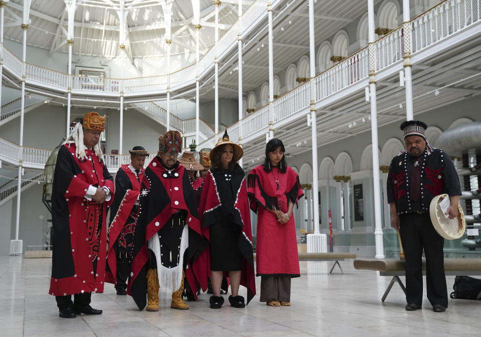 Earl Stephens, who has the Nisga'a cultural name Chief Ni'is Joohl and Dr Amy Parent, who has the Nisga'a cultural name Noxs Ts'aawit, and members of the delegation from the Nisga'a nation pause, during a visit to the National Museum of Scotland, in Edinburgh, Monday, Aug. 28, 2023. Members of a Canadian First Nation held a spiritual ceremony on Monday at a Scottish museum to begin the homeward journey of a totem pole stolen almost a century ago. The 11-meter (36-foot) pole is being restored by the National Museum of Scotland to the Nisga’a Nation in northern British Columbia — one of the first times a British museum has returned artifacts to North America’s Indigenous peoples. (Andrew Milligan/PA via AP)