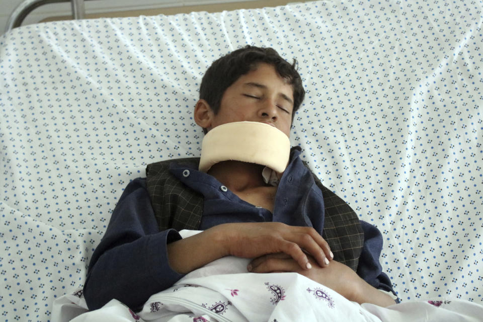 A wounded youth receives treatment at a hospital after gunmen stormed a mosque late on Tuesday, killing some worshipers and wounding several others, in Parwan province, north of Kabul, Afghanistan, Wednesday, May 20, 2020. In a second attack, also late Tuesday, a family returning from a mosque was attacked in Khost province and three brothers were killed. No one claimed responsibility for either attack but the Taliban immediately denied they were involved. (AP Photo)