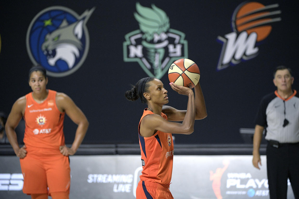 Connecticut Sun forward DeWanna Bonner, center, attempts a free-throw shot as center Brionna Jones (42), left, and official Mike Price watch during the second half of a WNBA basketball first round playoff game, Tuesday, Sept. 15, 2020, in Bradenton, Fla. (AP Photo/Phelan M. Ebenhack)