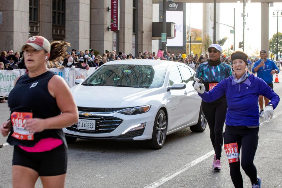 A vehicle is seen on the marathon course near the finish line during the 45th Annual Detroit Free Press Marathon in Detroit on Sunday, Oct. 16, 2022. 