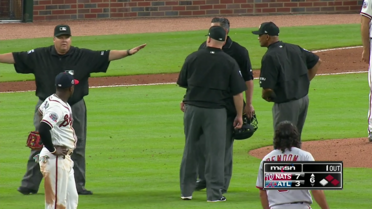 The umpires reversed CB Bucknor's original call, meaning Bryce Harper was safe at first. (MLB.TV)