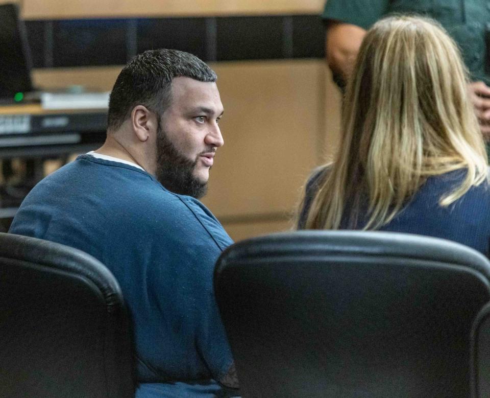 Hipolito Fraguela speaks with his defense attorney Mattie Fore during his sentencing hearing at the Palm Beach County Courthouse Thursday August 17, 2023. Fraguela, who was convicted on two counts of first-degree murder in July, received two life sentences without the possibility for parole from Circuit Judge Sarah Willis. 