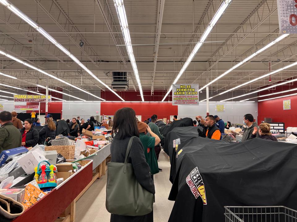 ppl gathered around bins waiting for them to be unveiled (V2)